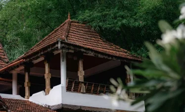 a building with a roof and a balcony